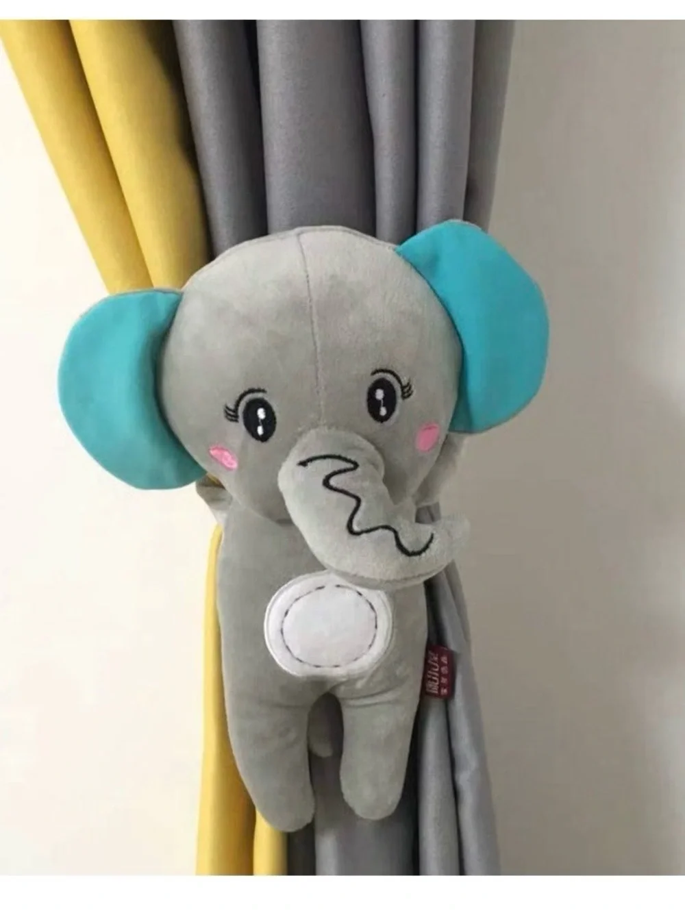 Animal curtain hold backs